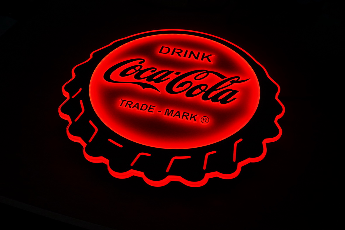 Illuminated Coca-Cola bottle cap sign